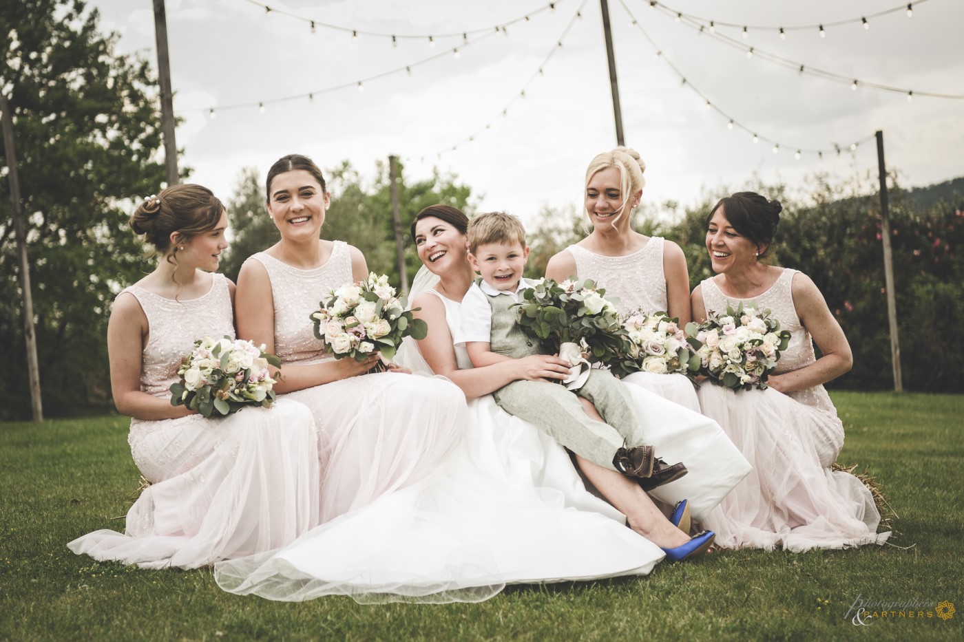 The bride with bridesmaids and pageboy.