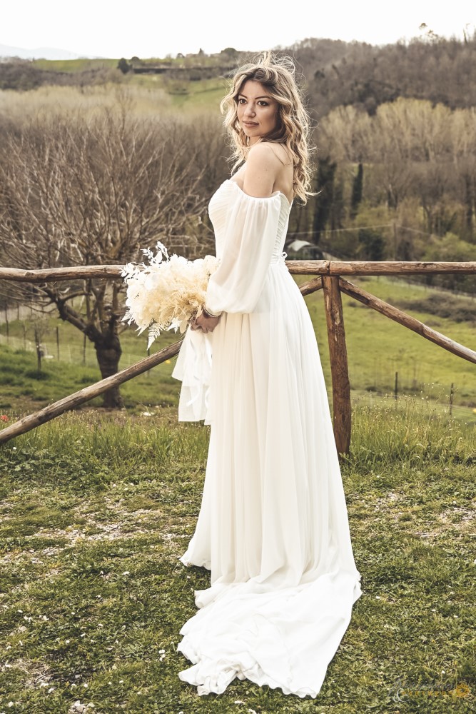 White dressed bride with the Tuscan background