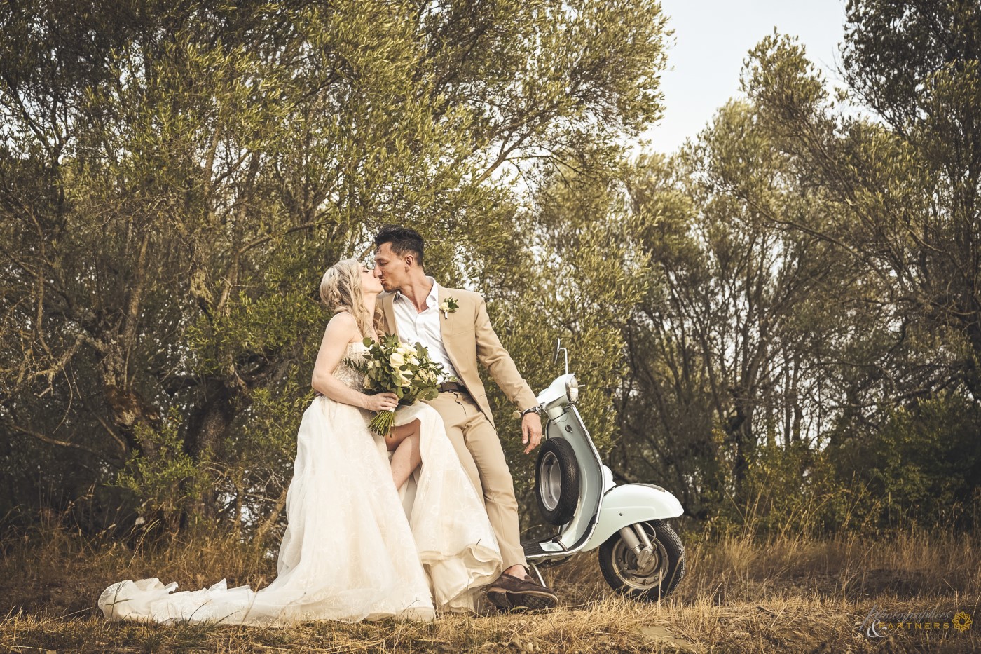 A kiss on the Vespa