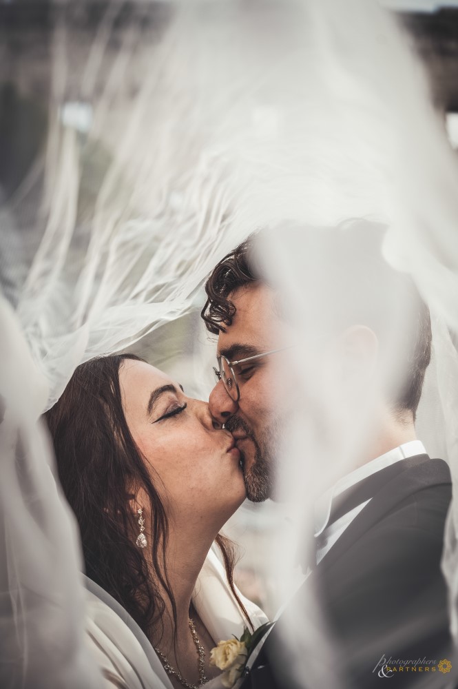 Romantic kiss under the veil